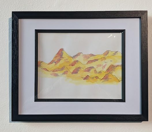 Image of a framed minimalist painting of mountains